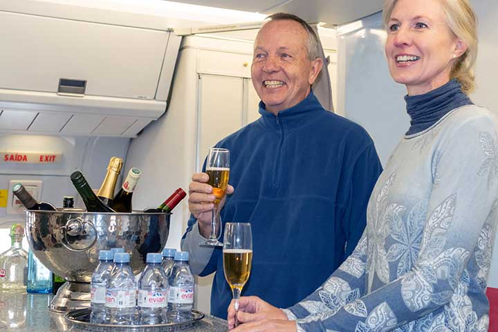 two people with champagne in boeing 767