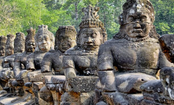 Diagonal row of large Cambodian statues