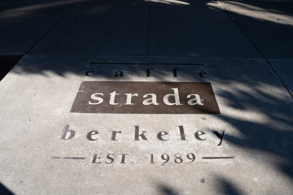 Caffè Strada's logo on the pavement. 