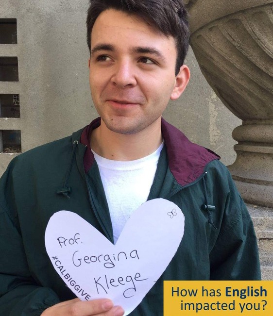 Jason Bircea holds a paper heart that reads “Prof. Georgina Kleege” for the 2017 Big Give campaign.