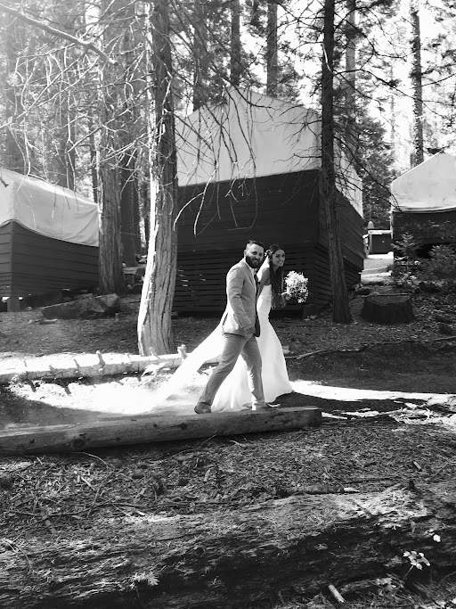 A bride and groom walking together outside