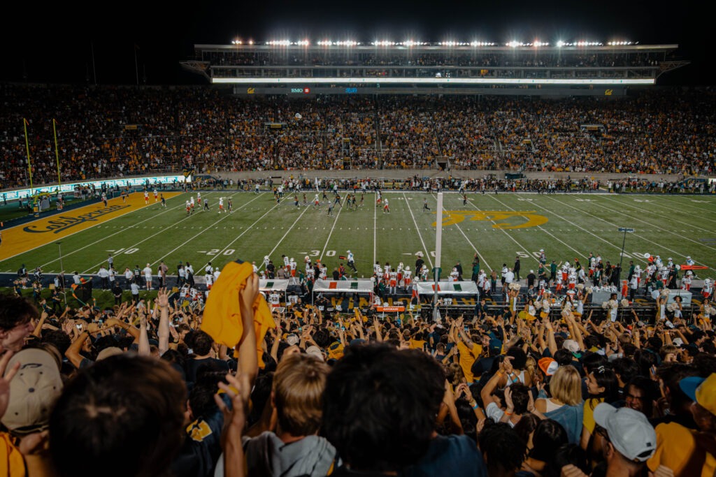 A view of Memorial Stadium at night during a football game.