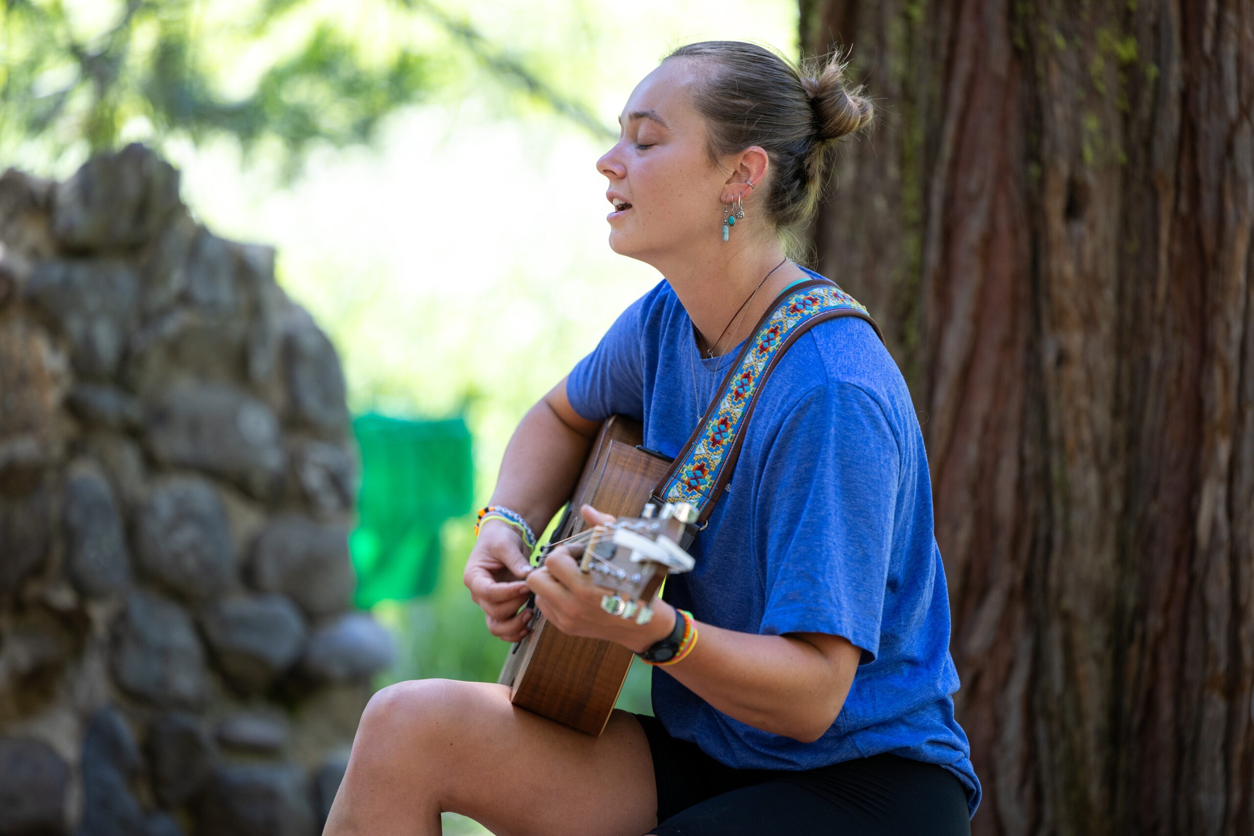 Camp Blue Music Director Cambry sings to the crowd. Photo by Kevin Kitsuda.